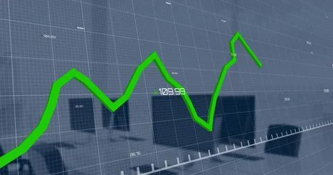 Image of green graph processing data over computers on desks at office Foto stock