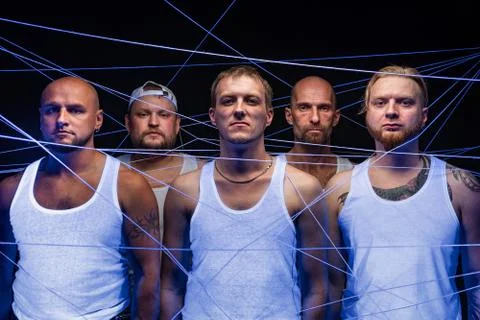 Image of group of men tangled in threads in ultraviolet Stock Photos