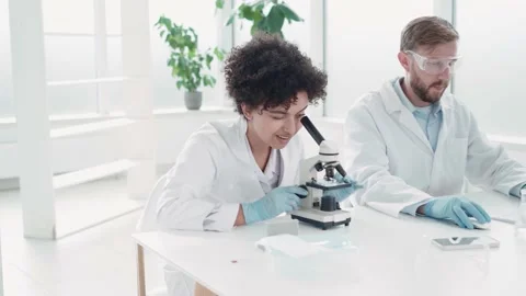 Image a group of scientists working in a laboratory. Stock Footage 236078674