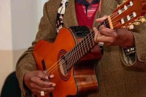 Image of a guitar player, without identifying the face Stock Photos