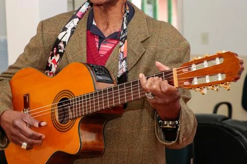 Image of a guitar player, without identifying the face Stock Photos