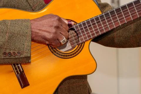 Image of a guitar player, without identifying the face Stock Photos