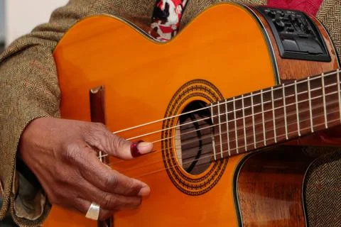 Image of a guitar player, without identifying the face Stock Photos