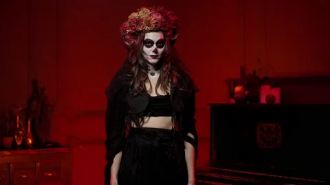 Image on halloween in style of Calavera in witch rags, with horns, painted skull Stock Footage 164044372