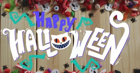 Image of halloween text over decorations and sweets on wooden background Ilustração Stock