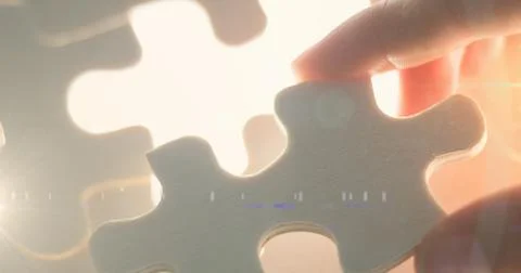 Image of hand of caucasian man adding puzzle on place Illustrazione stock