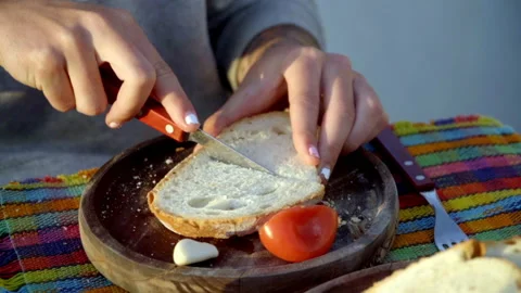 Image of a hand cooking a plate of bread with tomato garlic oil salt and Stock Footage 158723334