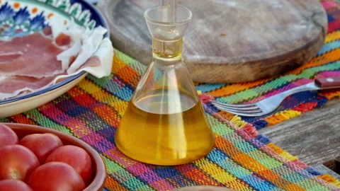 Image of a hand cooking a plate of bread with tomato garlic oil salt and Stock Footage 158723357