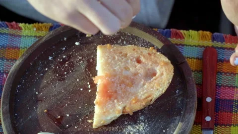 Image of a hand cooking a plate of bread with tomato garlic oil salt and Stock Footage 158723484