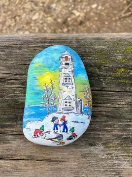 Image on a hand-painted stone Stock Photos