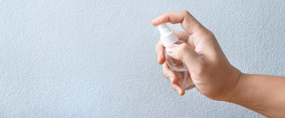 Image of hands using alcohol in bottle spraying hand washing cleaning anti vi 写真素材