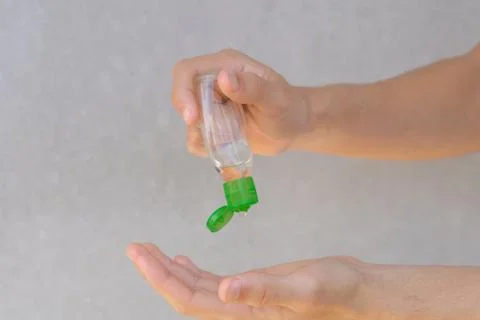 Image of hands using hand sanitizer. An antiseptic gel as protection against  Foto stock