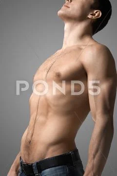 Image of handsome man with bare torso posing before camera Stock Photos