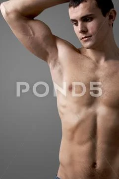 Image of handsome man with bare torso posing before camera Stock Photos
