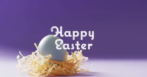 Image of happy easter text over blue easter eggs on purple background Stock Photos