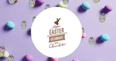 Image of happy easter text over colourful easter eggs on purple background Stock Photos