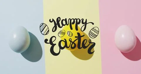 Image of happy easter text over colourful easter eggs on pink, yellow and blue Stock Photos