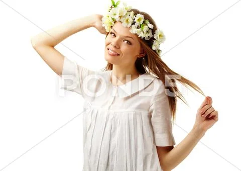 Image of happy female with floral wreath on head looking at camera Stock Photos