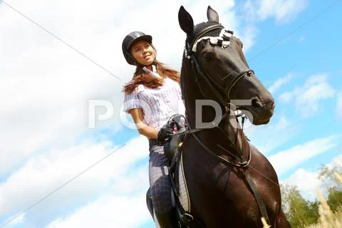 Image of happy female jockey on purebred horse outdoors Stock Photos