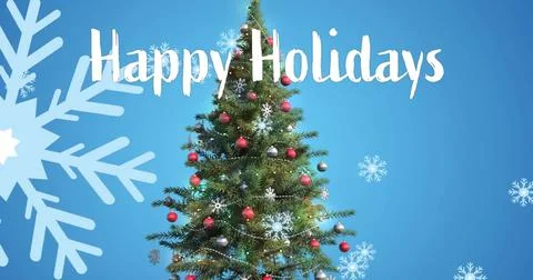 Image of happy holidays text and snow falling over christmas tree on blue Illustrazione stock