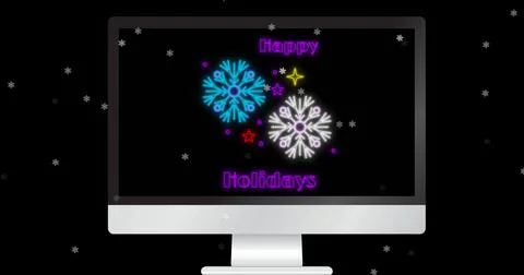 Image of happy holidays text on computer over snow falling on black background Illustrazione stock