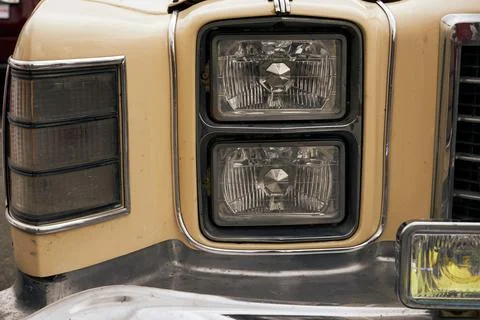 An image of a headlight of an old car. Stock Photos
