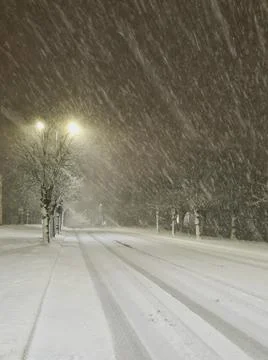 Image of heavy snowfall. Diluted road in the city. Snowstorm in the city. Stock Photos