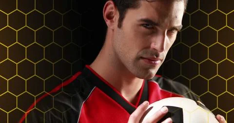 Image of hexagonal grid and light over portrait of caucasian male soccer player Stock Photos