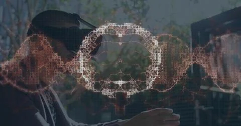 Image of human brain spinning and data processing over man wearing vr headset Stock Photos
