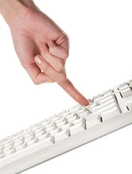 Image of human forefinger pushing button of computer keyboard Stock Photos