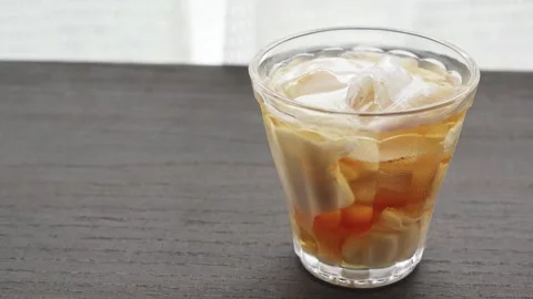 Image of iced tea on a table by the window Stock Footage 285280964