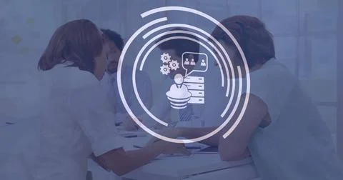 Image of icon in loading circles over diverse coworkers discussing reports in Foto stock