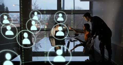 Image of icons and data processing over diverse business people working in Foto stock