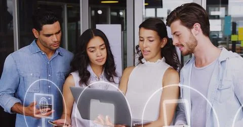 Image of icons and data processing over diverse business people in office 스톡 사진