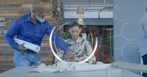 Image of icons and data processing over diverse business people in office Stock Photos