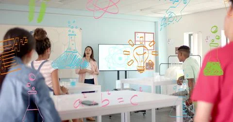 Image of icons and data processing over diverse students at school Foto stock