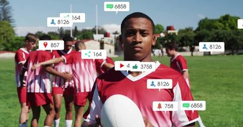 Image of icons and data processing over diverse rugby players Foto stock