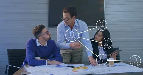 Image of icons and data processing over diverse business people in office 库存照片