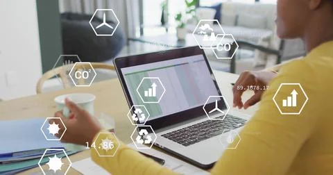 Image of icons and data processing over african american businesswoman in office 库存照片