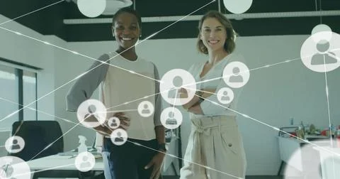 Image of icons connected with lines over smiling diverse coworkers standing in Stockfoto's