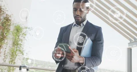Image of icons with data processing over african american businessman in office Stock Photos