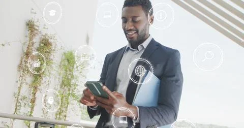 Image of icons with data processing over african american businessman in office Stock Photos