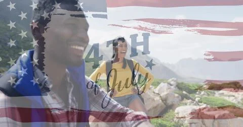 Image of independence day text over smiling diverse couple hiking Fotos Stock