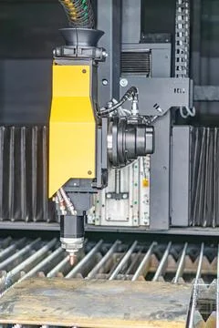 Image of an industrial setting, featuring a robotic arm over a conveyor syste Stock Photos