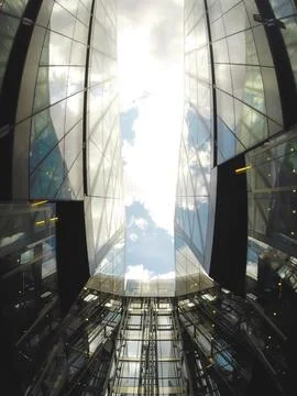 Image from the inside of a building looking up with large reflecting planes.. Stock Photos