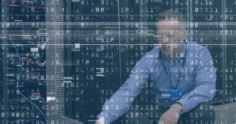 Image of interference and binary coding over caucasian man using laptop in 库存照片