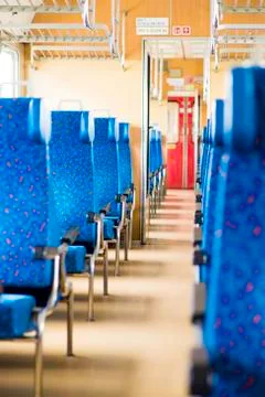Image with the interior of a Czech train. An older train with comfortable and Stock Photos