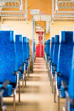 Image with the interior of a Czech train. An older train with comfortable and Stock Photos