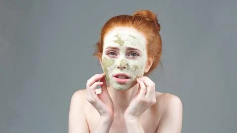 The image of an irritated attractive young model with a mask on her face Stock Photos
