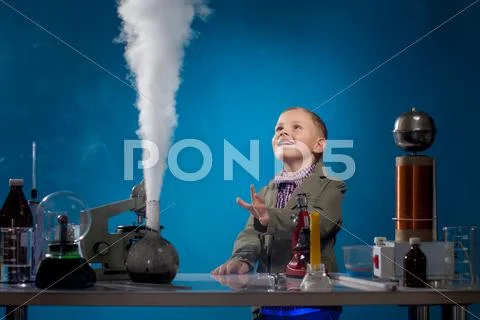Image of joyful boy watching reagent evaporation Stock Photos